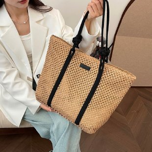 Beach bag made of hand-woven natural material with sturdy handles Stornfield