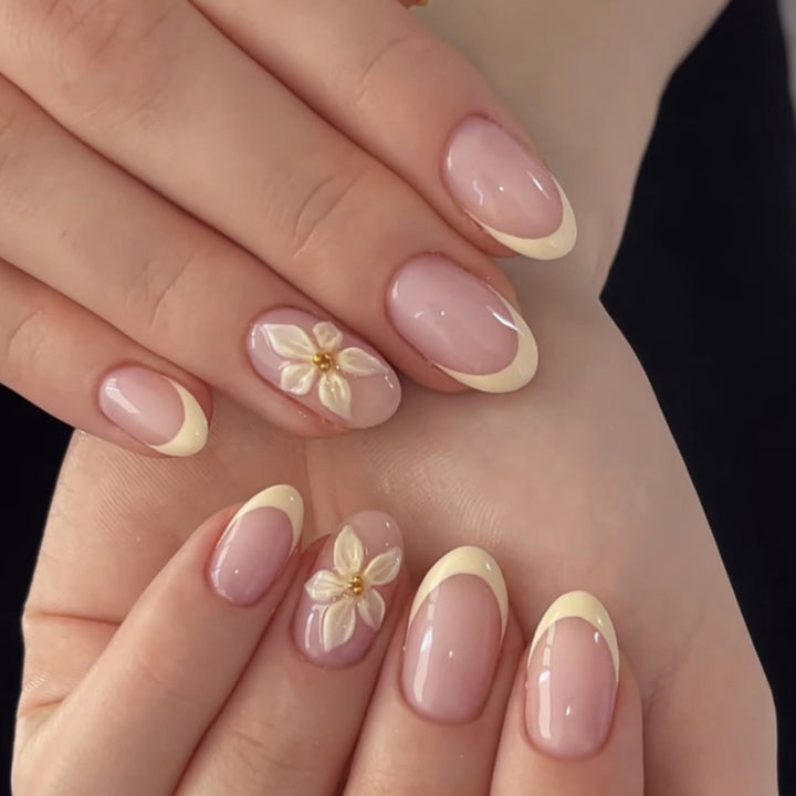 Artful stiletto nails with elegant floral design and glitter details Stornfield