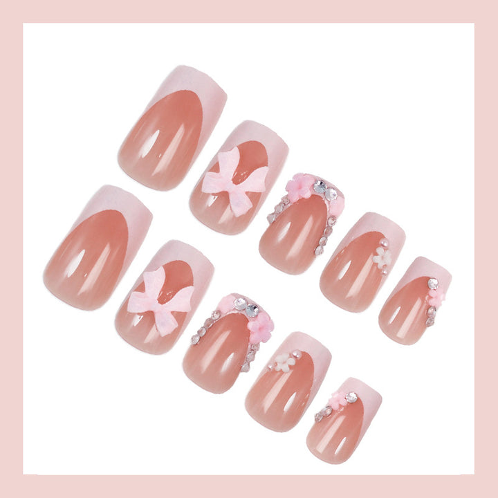 Artificial nail set with playful bows and elegant floral decorations Stornfield