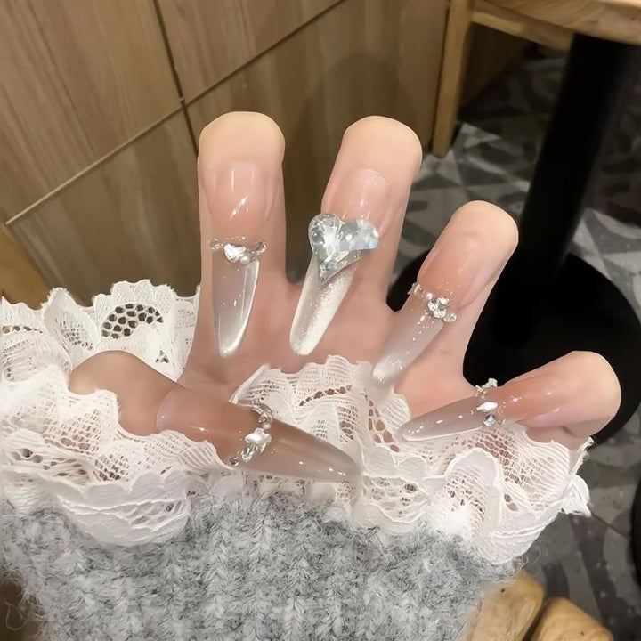 Glamorous artificial nail tips with elegant decorations Stornfield