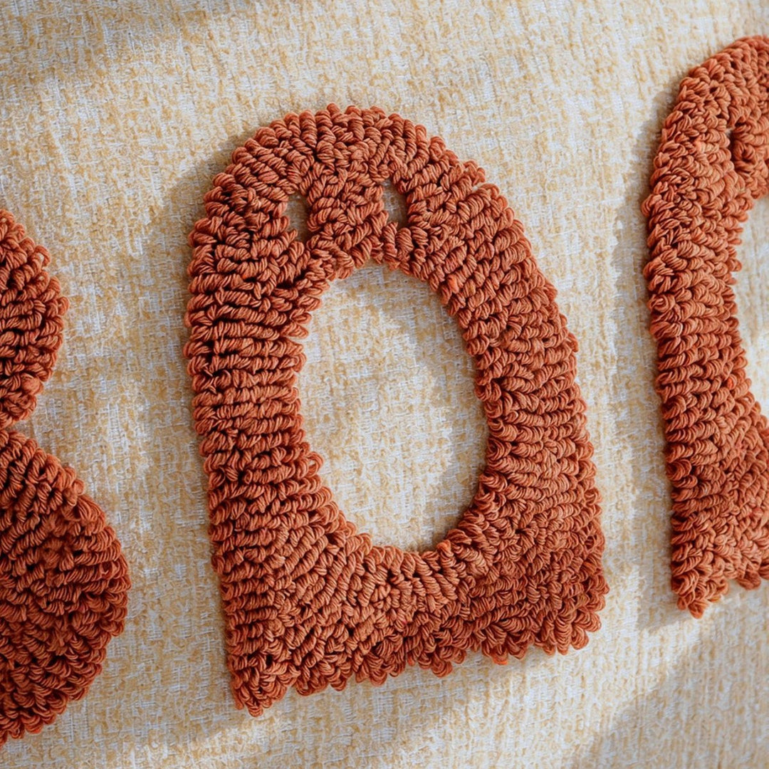 Decorative pillow with playful lettering