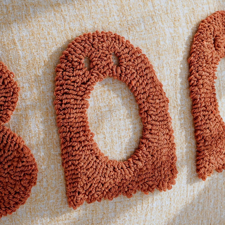 Decorative pillow with playful lettering