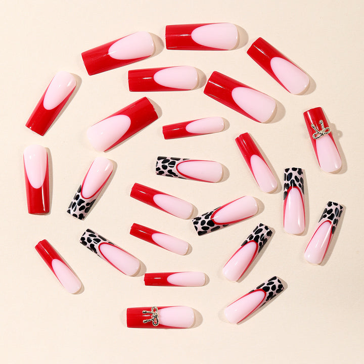 Stylish Acrylic Nail Extensions with Bow and Leopard Print Stornfield