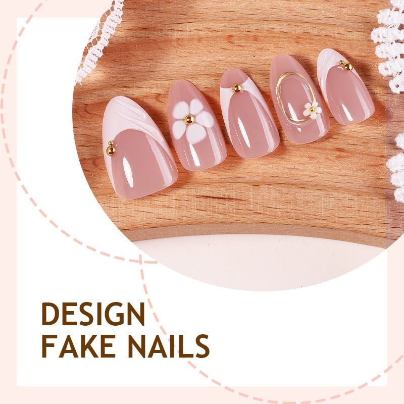 Artificial nail set with romantic floral designs and delicate accents Stornfield