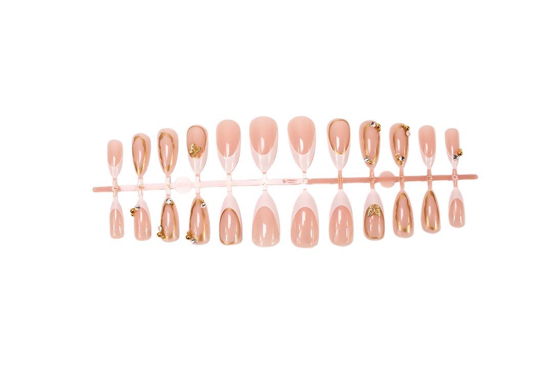 Artificial nail set with elegant gold accents and luxurious decorations Stornfield