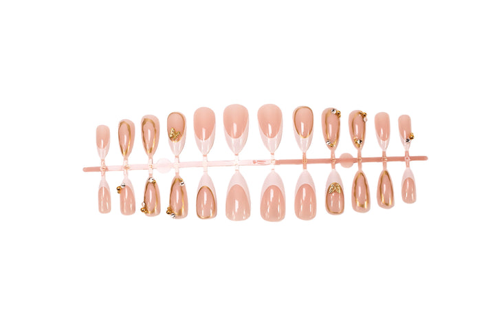 Artificial nail set with elegant gold accents and luxurious decorations Stornfield