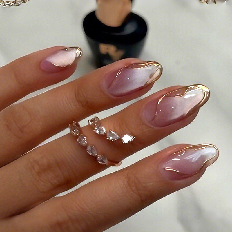 Acrylic nail set with glamorous gradient and golden accents Stornfield