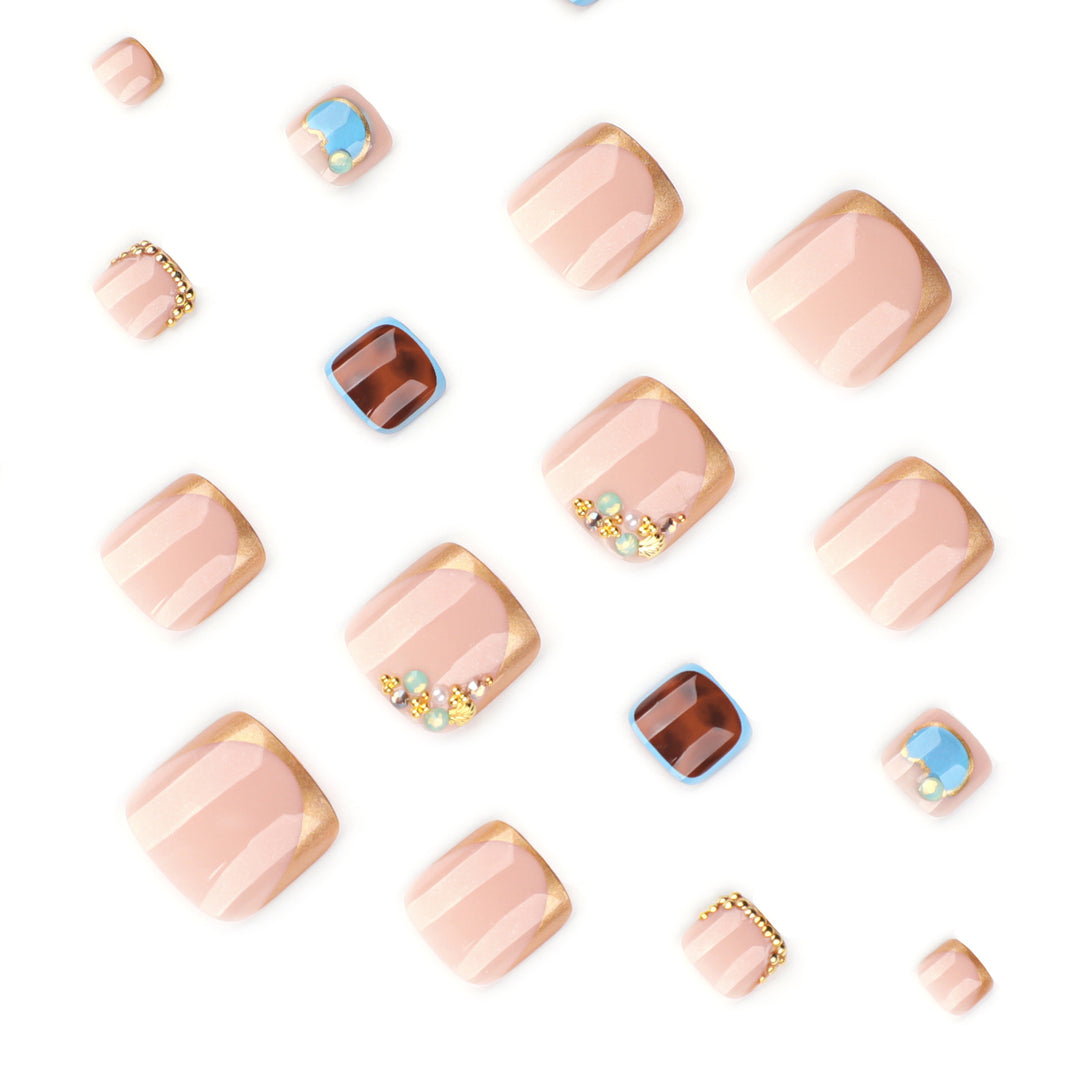 Artistic toenail art with elegant gold design Stornfield