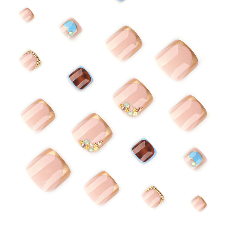 Artistic toenail art with elegant gold design Stornfield
