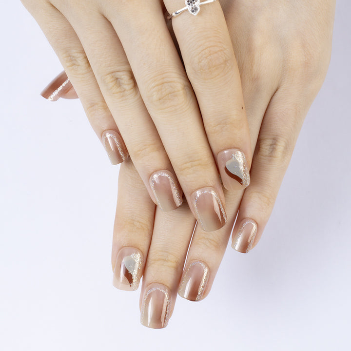 Elegant Nail Art with Glitter and Stylish Accents Stornfield