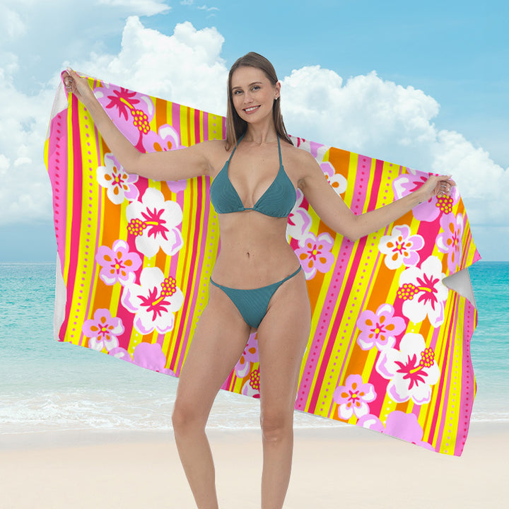 Beach towel with vibrant tropical plant motif Stornfield