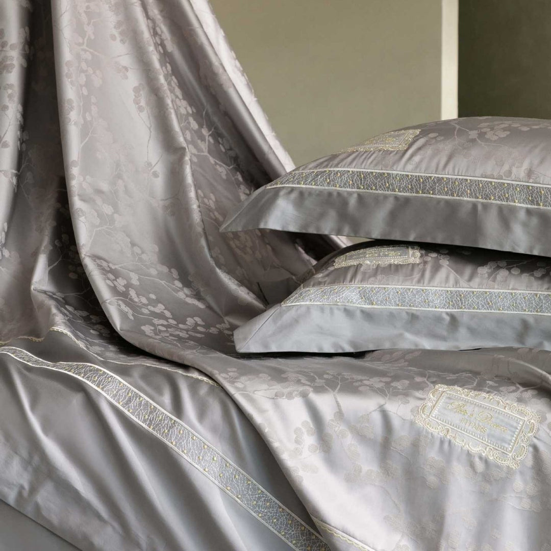 Luxurious satin bedding with jacquard floral pattern and lace trim