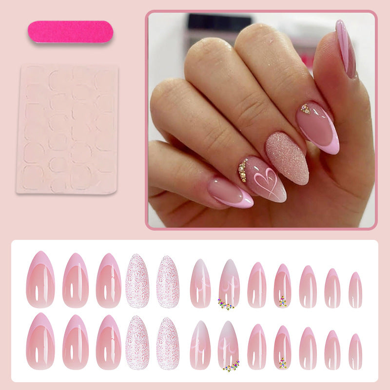 Artificial nail set with delicate glitter and heart designs Stornfield