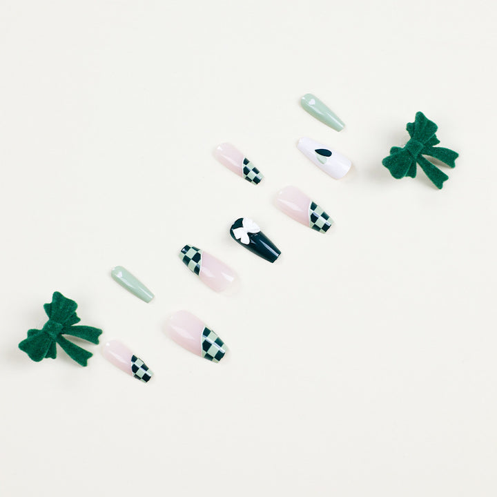Artificial nail extensions with creative design and glitter accents Stornfield