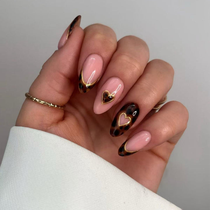 Artful stiletto nails with elegant heart design Stornfield