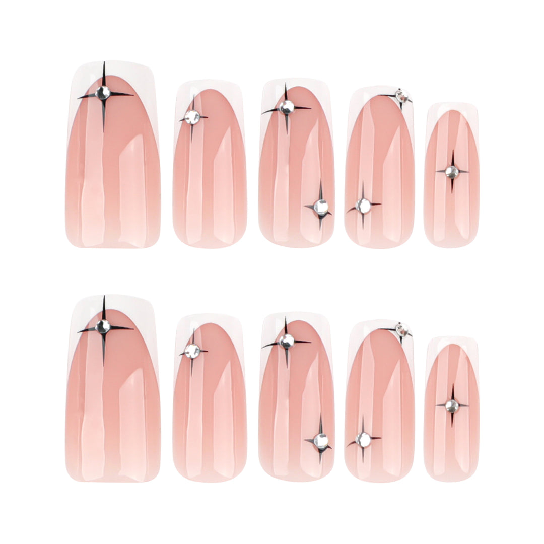 Artificial nail extensions with elegant French tip and glitter accents Stornfield
