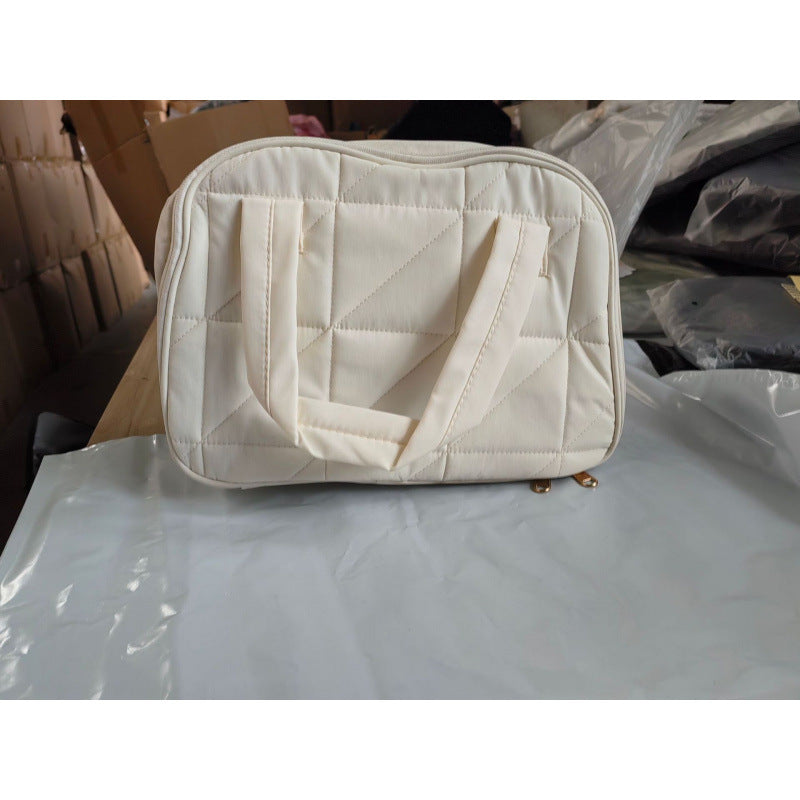 Cosmetic bag with padded interior compartment Stornfield