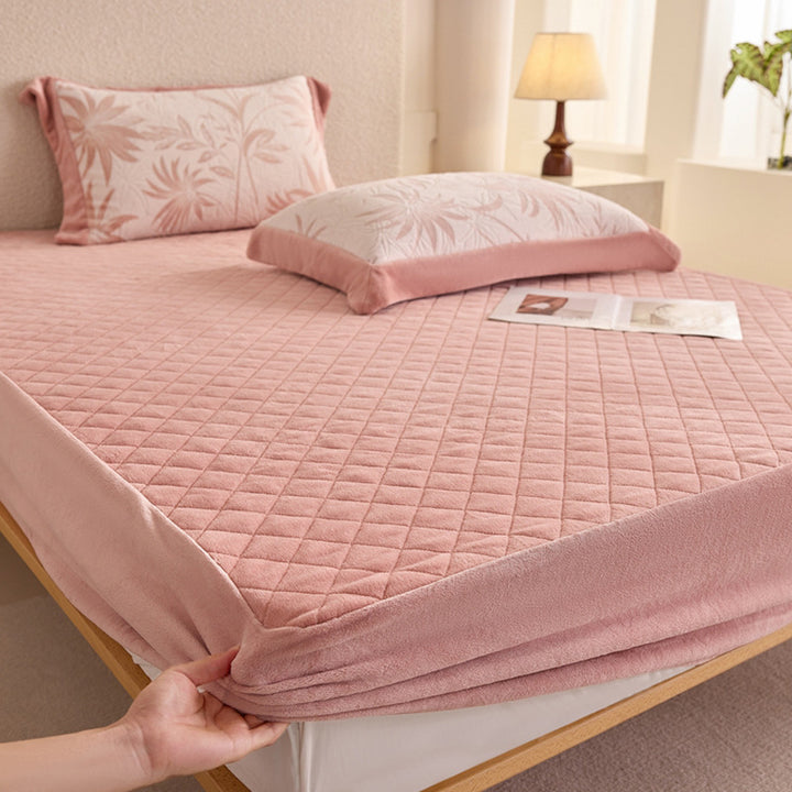 Quilted mattress protector with non-slip bottom and soft microfiber cover