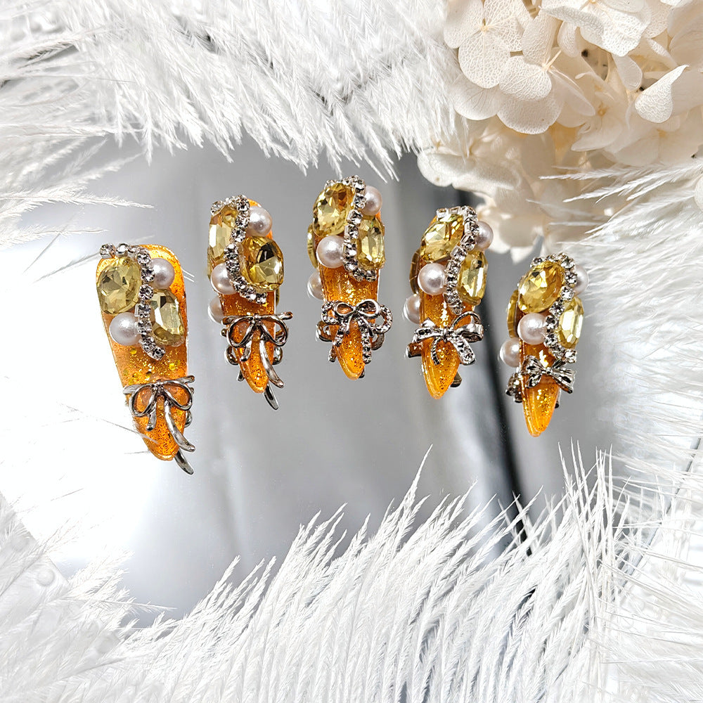 Glamorous artificial nails with rhinestones and pearl embellishments Stornfield