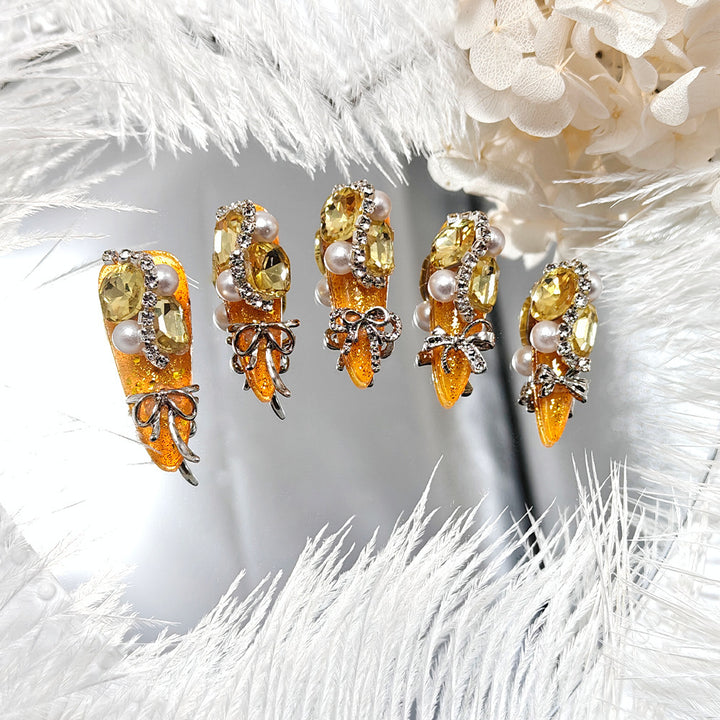 Glamorous artificial nails with rhinestones and pearl embellishments Stornfield