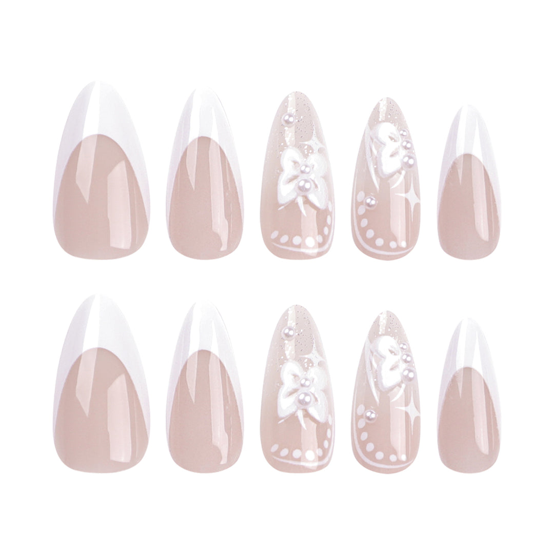 Artful stiletto nails with floral designs and glitter accents Stornfield