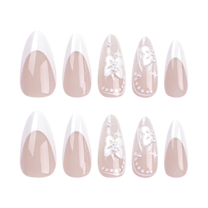 Artful stiletto nails with floral designs and glitter accents Stornfield
