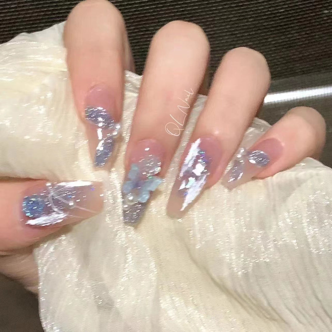 Artistic 3D nail extensions with glitter accents Stornfield