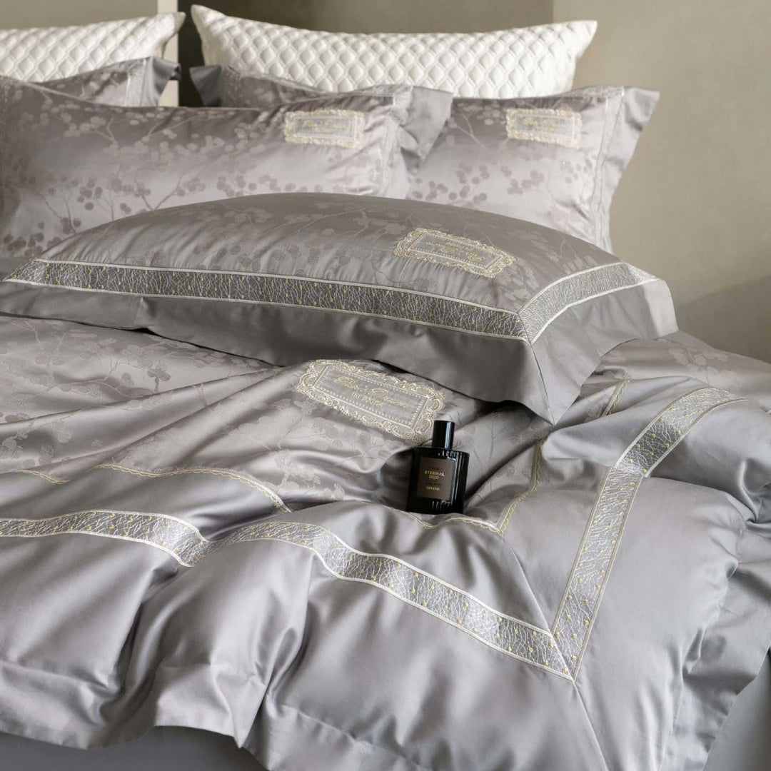 Luxurious satin bedding with jacquard floral pattern and lace trim