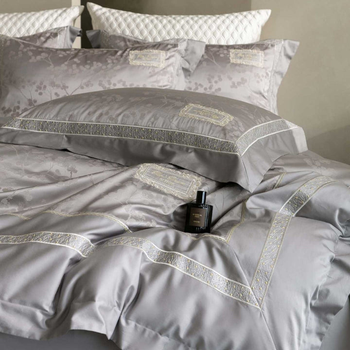 Luxurious satin bedding with jacquard floral pattern and lace trim