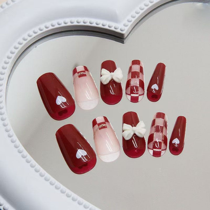 Artificial nails with decorative heart and bow details Stornfield