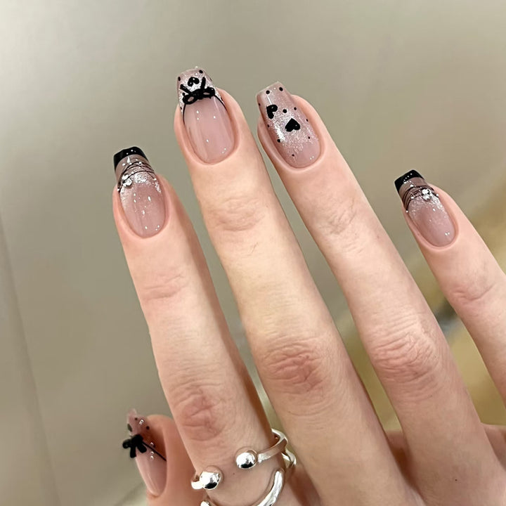 Elegant Artful Nail Design with Bow and Sparkle Accents Stornfield