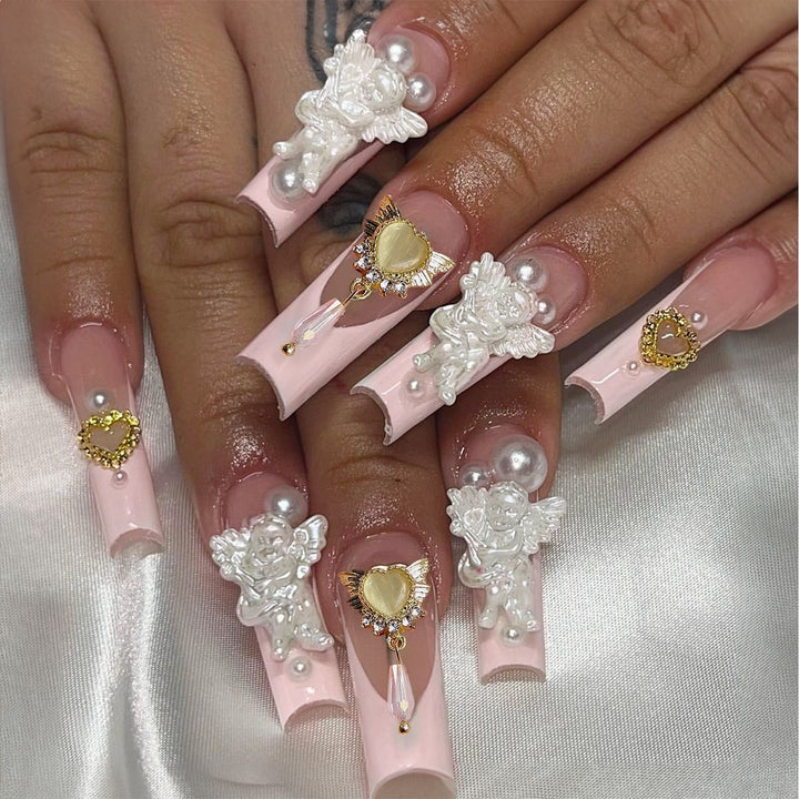 Creative acrylic nail set with delicate pearl and gloss accents Stornfield