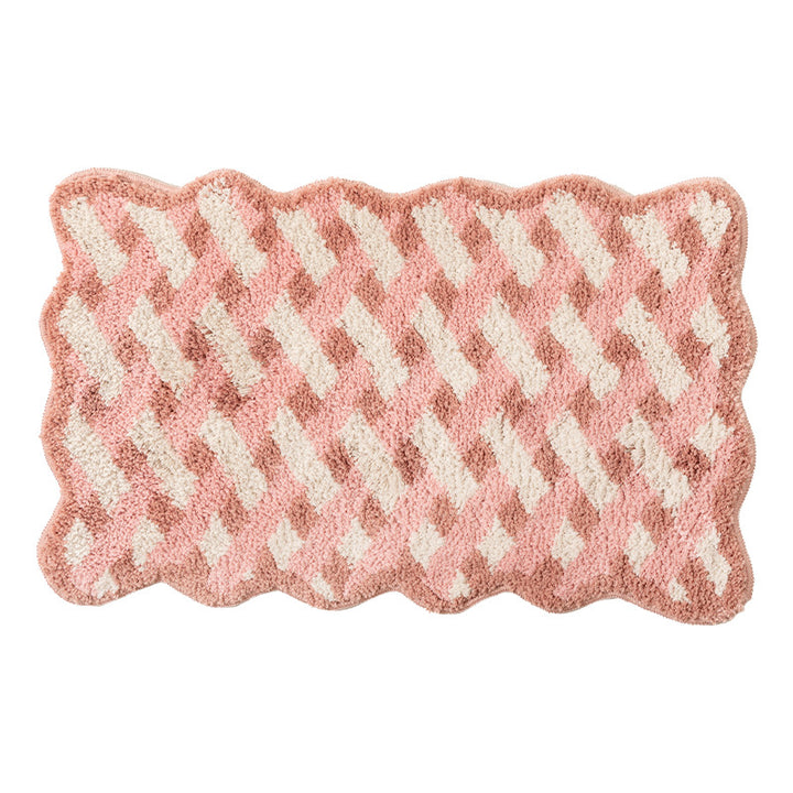 Tufted bathroom runner with wavy hem and relief-style braided pattern Stornfield