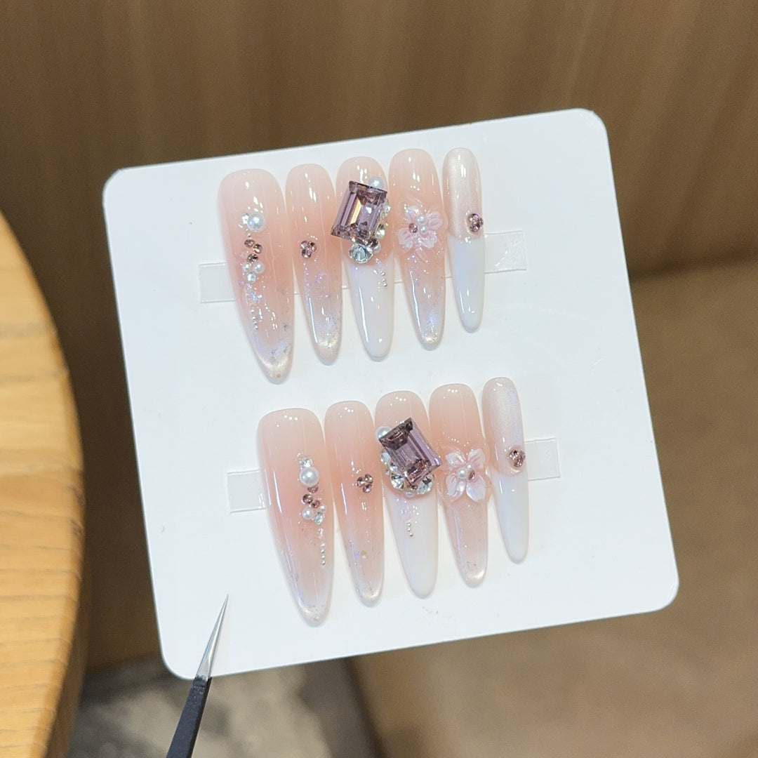 Artificial nails with elegant jewelry details Stornfield