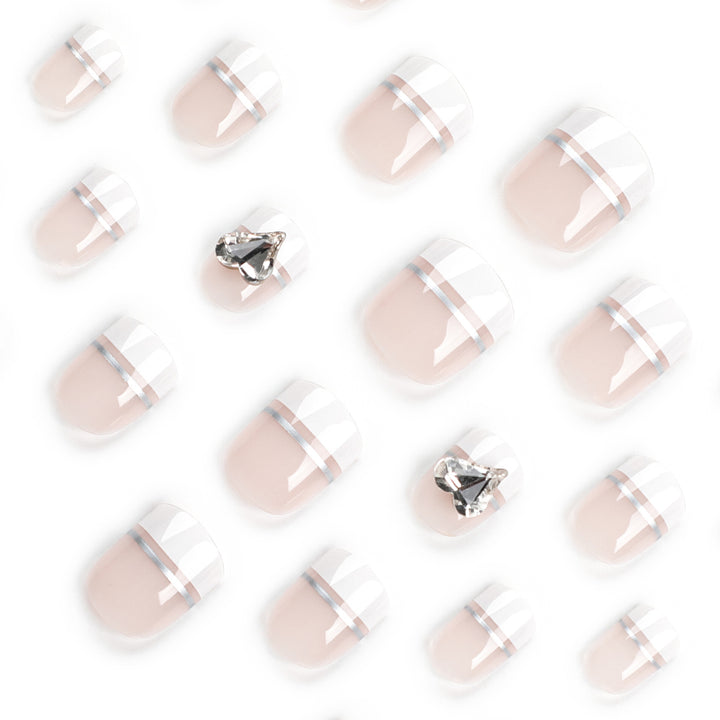 Elegant Nail Art with Glitter Accents and Jewelry Details Stornfield