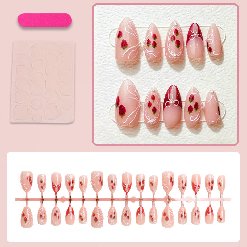 Artificial nail set with romantic strawberry and bow motifs Stornfield