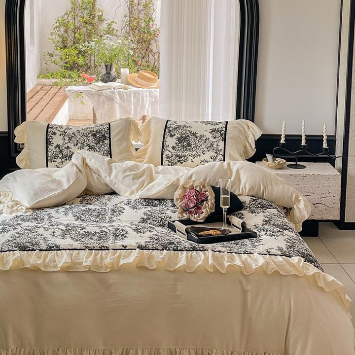 Romantic reversible bedding set made of fine cotton satin with ruffled flounces and toile design