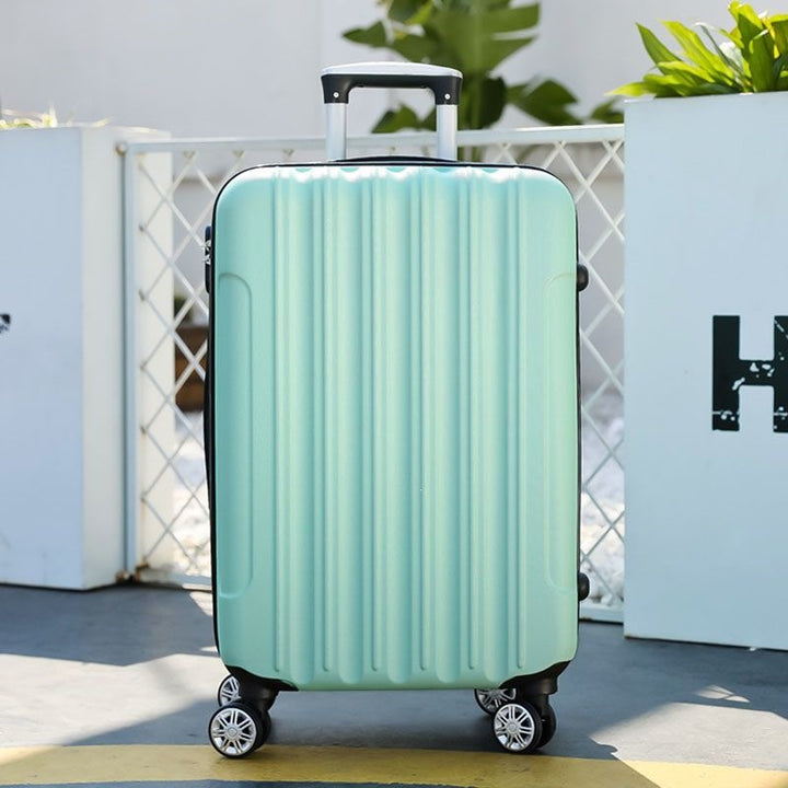 Hard shell suitcase with 360-degree wheel system and integrated safety feature Stornfield