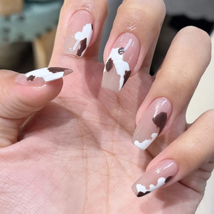 Artistic acrylic nails with elegant gradient and creative designs Stornfield