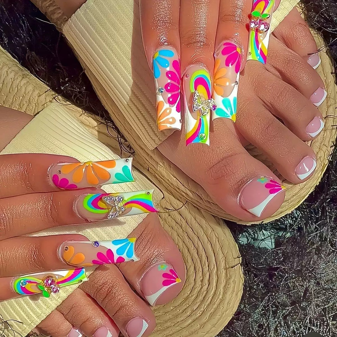 Nail art set with glowing flower motifs and glitter accents Stornfield