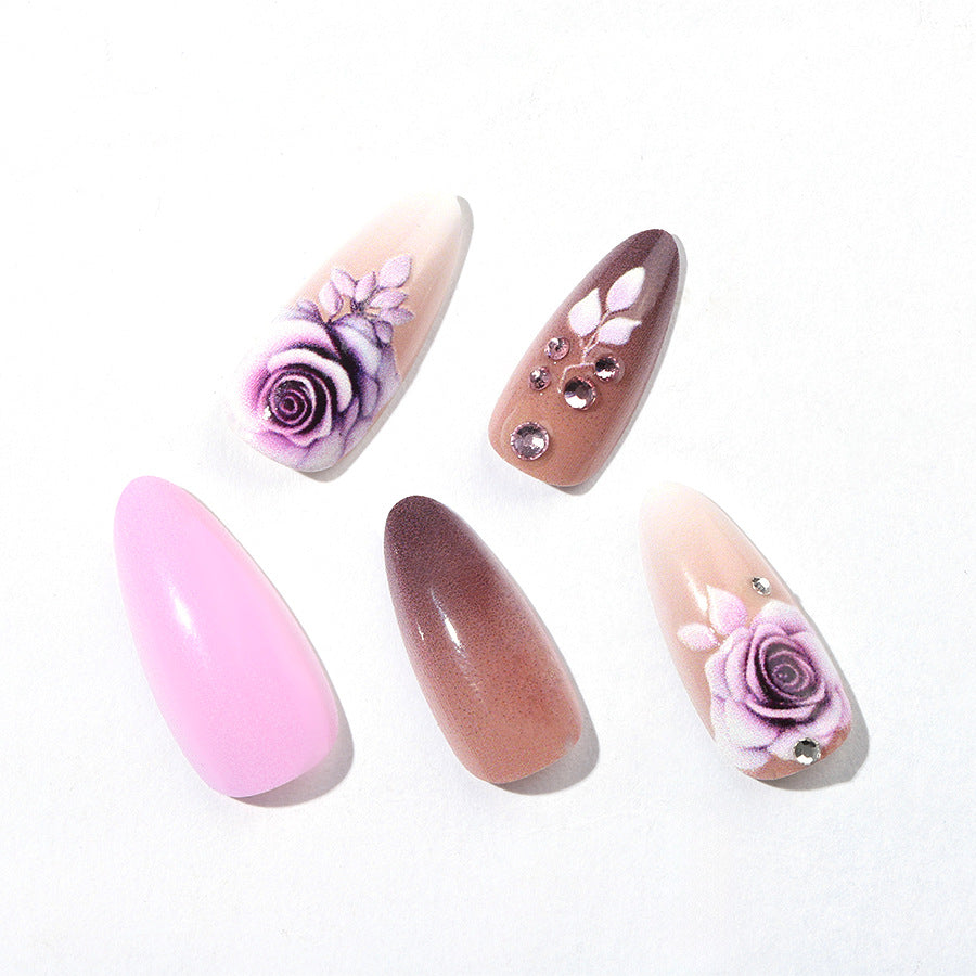 Creative nail art set with elegant rose accents and soft color gradient Stornfield
