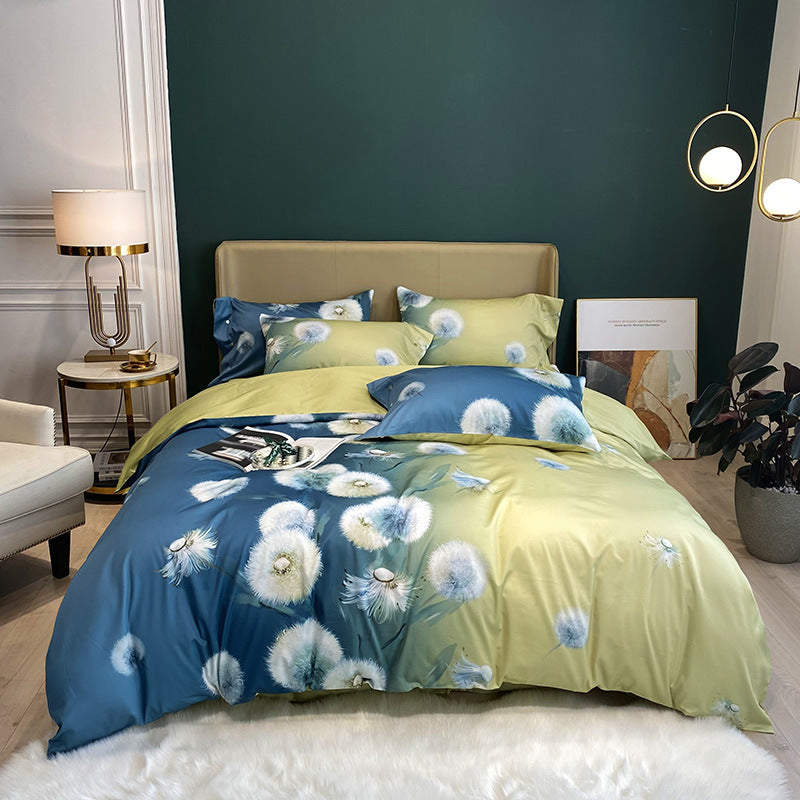 Cotton satin bedding set with watercolor flower print and reversible blanket
