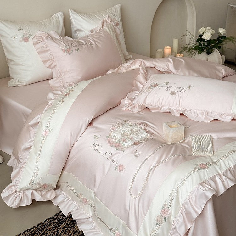 Delicate embroidered cotton satin bedding set with ruffle, satin trim, and rose motif