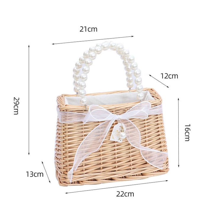 Ladies handbag made of braided material with elegant pearl handles Stornfield