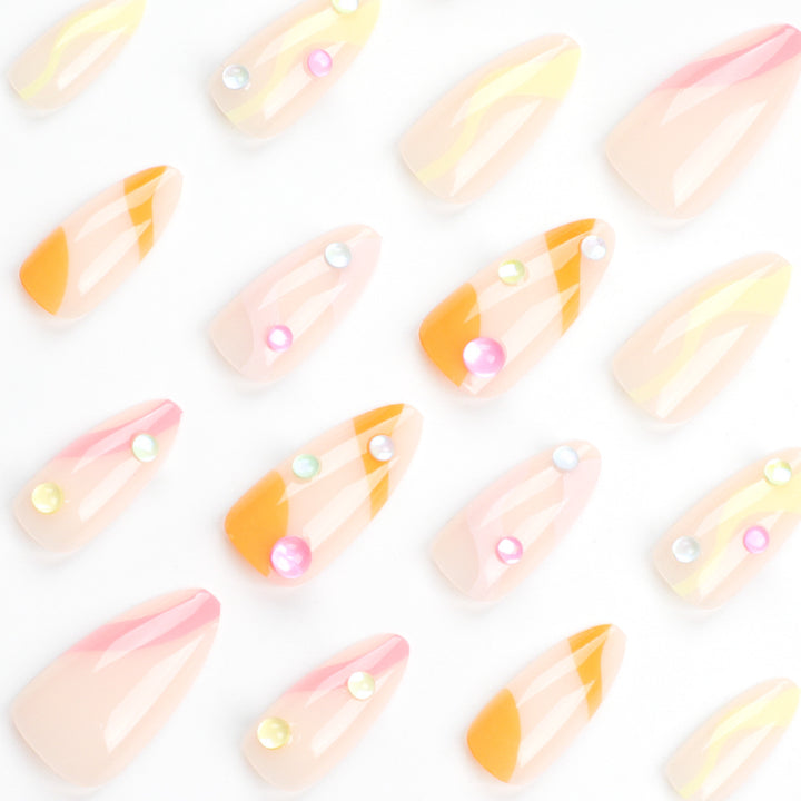 Artistic Nail Extensions with Colorful Design and Glitter Accents Stornfield