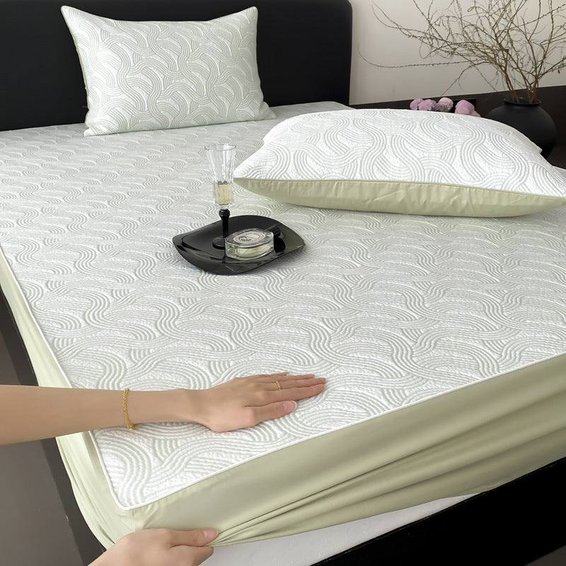 Quilted mattress protector with all-round elastic and floral relief structure