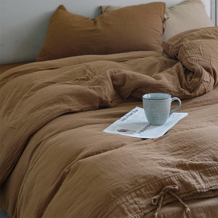 Natural linen bedding set with decorative ties and stonewashed texture