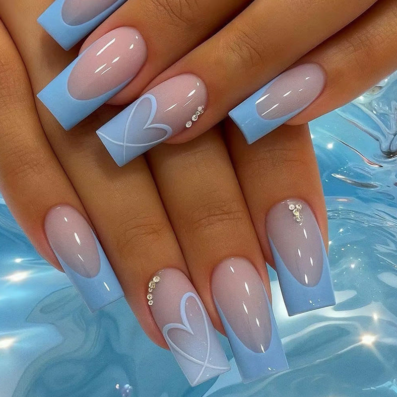 Artificial nail set with romantic heart designs and glamorous accents Stornfield