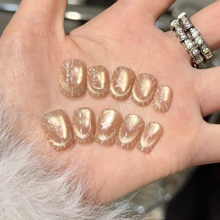 Shiny artificial nail tips with romantic shimmer Stornfield