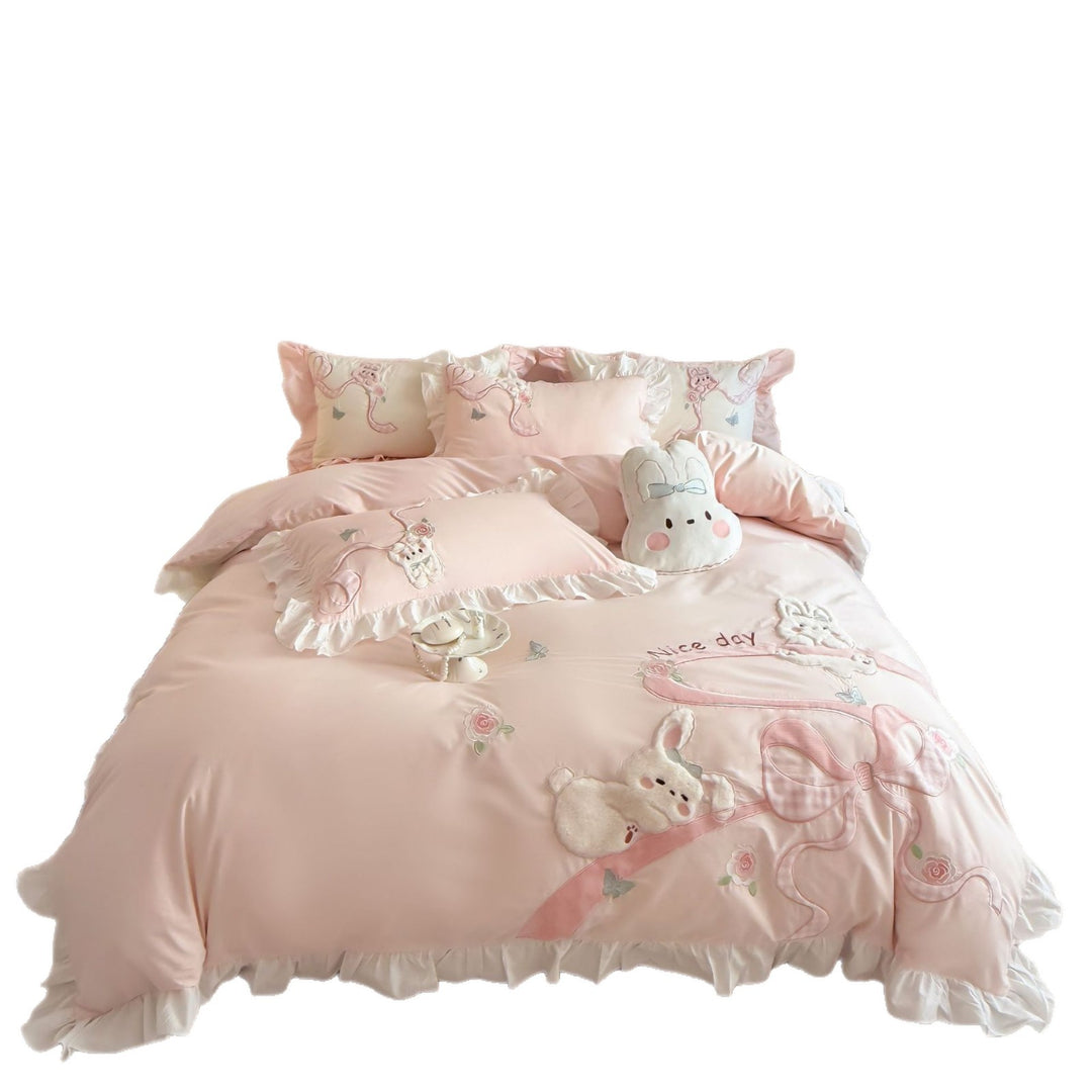 Romantic cotton satin bedding set with ruffles, plush appliqués and fine embroidery